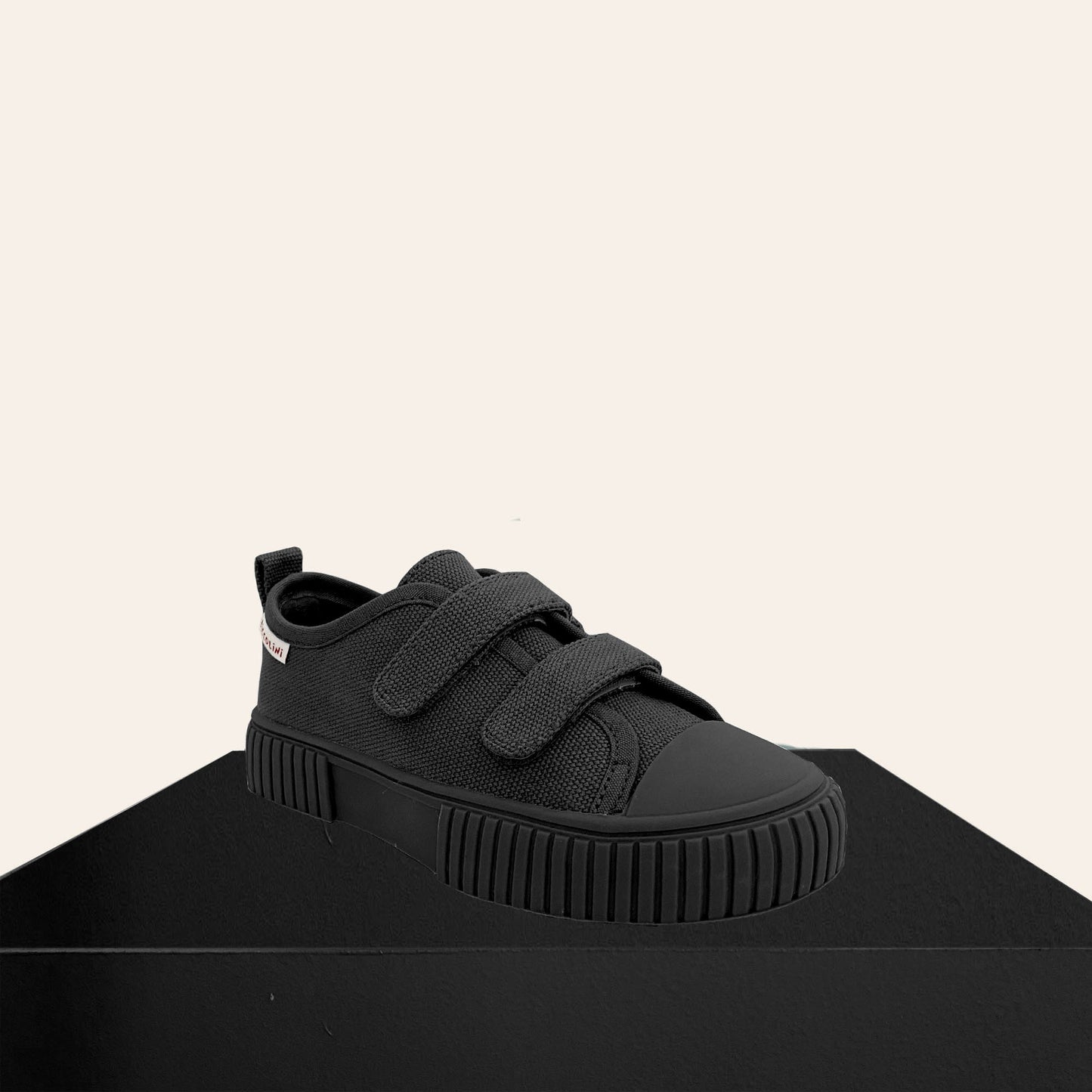 Black low top kids sneaker