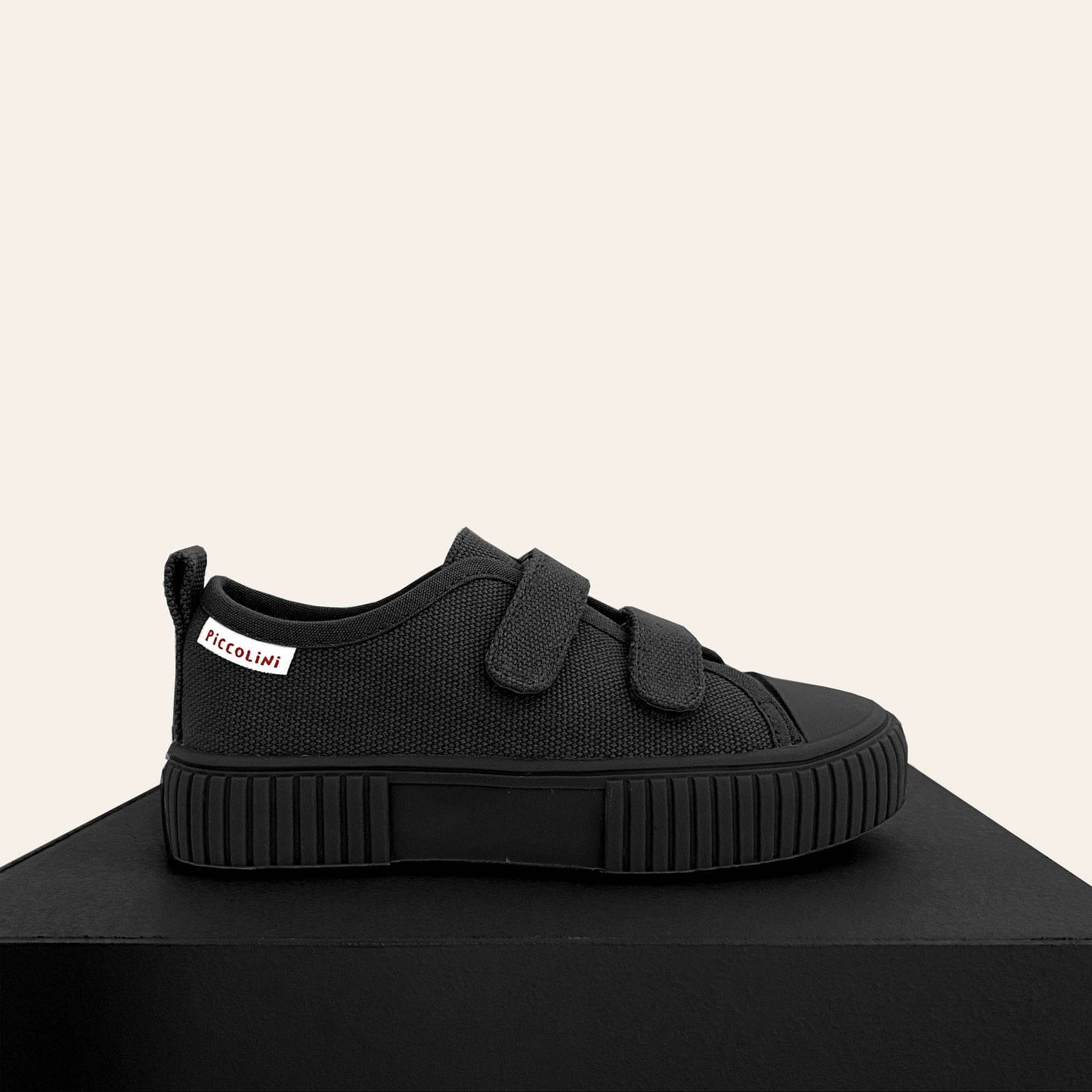 Black low top kids sneaker